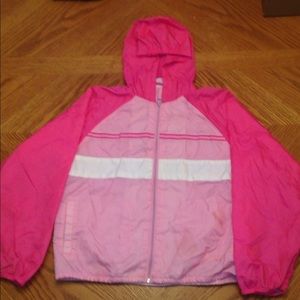 Pink wind breaker jacket.